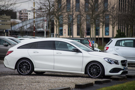 Mulhouse - france - 18 January 2020 - Profile view of white Mercedes Benz coupe Parked in the street