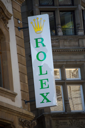 Basel - Switzerland - 7 February 2020 - Closeup of Rolex logo on signboard on jewelry front in the streetのeditorial素材
