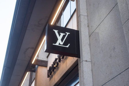 Basel - Switzerland - 7 February 2020 - Closeup of Louis Vuitton logo on signboard on store front in the streetのeditorial素材