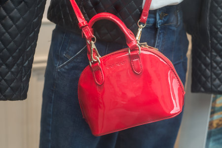 Mulhouse - France - 16 February 2020 - Closeup of red leather handbag by Naf Naf, the famous french luxury brand in a fashion store showroomのeditorial素材