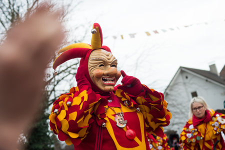 Neuenburg - Germany - 23 February 2020 - portrait of people with carnival mask of joker parading in the streetのeditorial素材