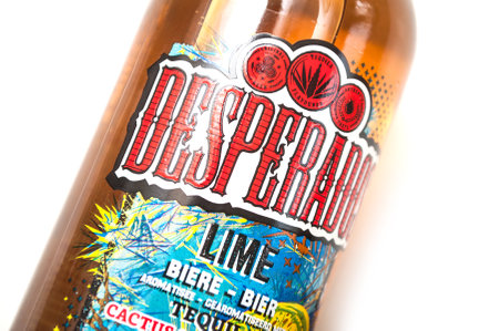 Mulhouse - France - 2 March 2020 - Closeup of Desperados bier lemon bottles on white background, desperados is the famous brand of mexican bier with tequilaのeditorial素材