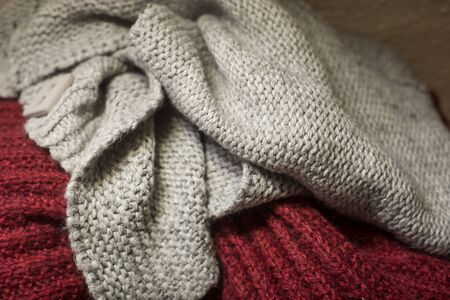 Closeup of woolen pullover stacked at homeの写真素材