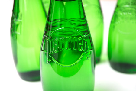 Mulhouse - France - 26 March 2020 - Closeup of carbonated water by Perrier on white background