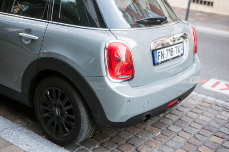 Mulhouse - France - 3 April 2020 - Rear vieuw of grey mini cooper parked in the street