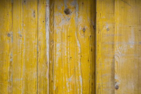 Closeup of yellow wooden door textureの写真素材