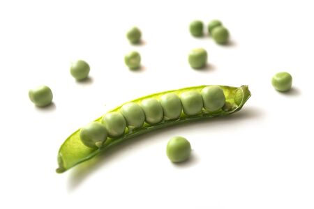 Closeup of fresh organic peas on white backgroundの写真素材