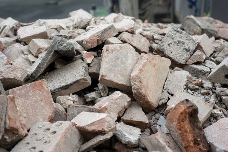 Closeup of broken bricks stack in demolition site