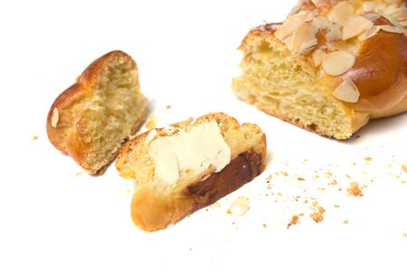 Closeup of braided almonds cake on white background