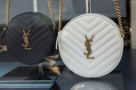 Mulhouse -  France - May 16 2020 - Closeup of Black and white leather handbag by Yves Saint Laurent in a luxury fashion Store showroomのeditorial素材