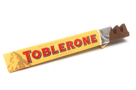 Mulhouse - France - 27 May 2020 -Closeup of Toblerone chocolate bar in yellow packaging on white backgroundのeditorial素材