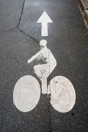 retail of white painted Bicycle lane signage  in the street 