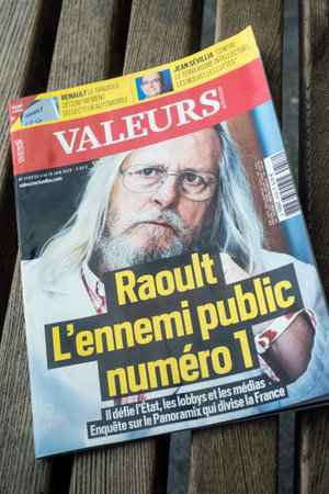 Mulhouse - France - 5 June 2020 - Didier Raoult on magazine cover with text in french traduction in english public enemy number 1- the famous professor director of the Marseille university hospitalのeditorial素材