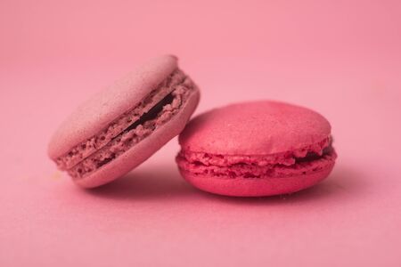 Closeup of french traditional macarons on pink backgroundの写真素材