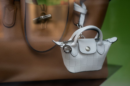 Mulhouse - France - 14 June 2020 - Closeup of white mini handbag by Longchamp in a luxury fashion store showroomのeditorial素材