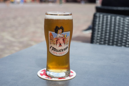 Mulhouse  France - 27 June 2020 - Closeup of glass of french beer from Paulaner" brand at restaurant terraceのeditorial素材