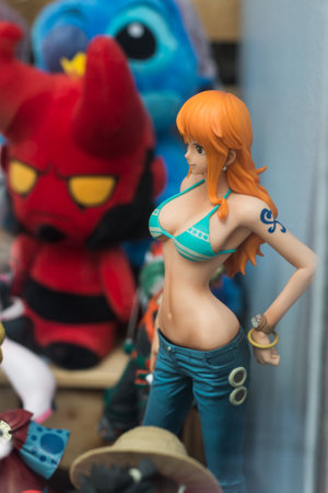 Mulhouse - France - 5 July 2020 - Closeup of stripped swimsuit printed with Mickey mouse by Walt Disney on mannequin in a fashion store showroomのeditorial素材