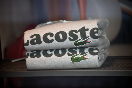 Mulhouse - France - 10 August 2020 - Closeup of grey sweatshirt pile by Lacoste in a sport fashion...