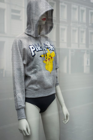 Mulhouse - France - 6 September 2020 - Closeup of pikachu manga character on grey sweat shirt on mannequin in fashion store showroom for womenのeditorial素材