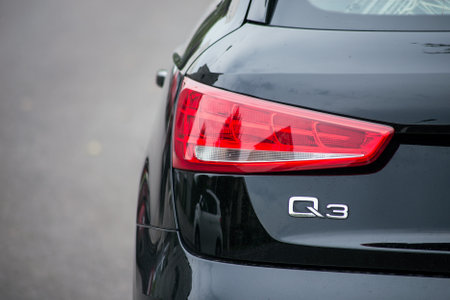 Riedisheim - France - 19 September 2020 - Closeup of rear light and sign of black Q3 parked in the streetのeditorial素材