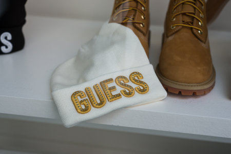 Mulhouse - France - 20 September 2020 - Closeup of woolen hat by Guess in a fashion store showroom