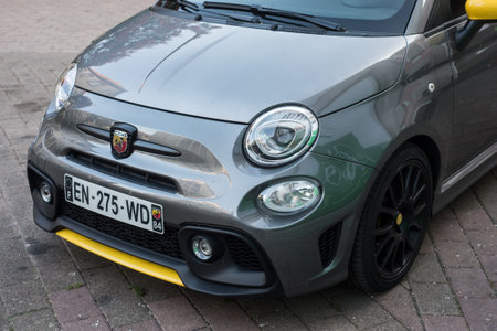 Mulhouse - France - 20 September 2020 - Closeup of grey Abarth 595 car front parked in the street