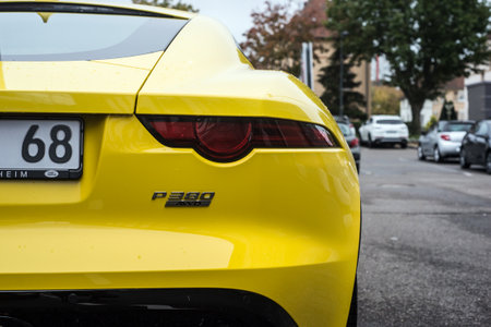 Mulhouse - France - 10 October 2020 - Rear view of yellow Jaguar F-Type parked in the streetのeditorial素材