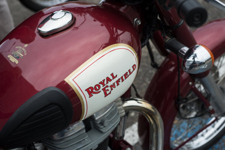 Mulhouse - France - 11 October 2020 - Closeup of red tank of Royal enfield motorbike parked in the...