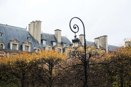 closeup of vintage street light in vosges square in Paris