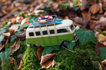Mulhouse - France - 9 November 2020 - Closeup of Volkswagen miniature toy van in the autumnal forestのeditorial素材