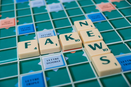 Mulhouse - France - 22 November 2020 - Closeup of scrabble letters forming the word "Fake News"  on the game boardのeditorial素材