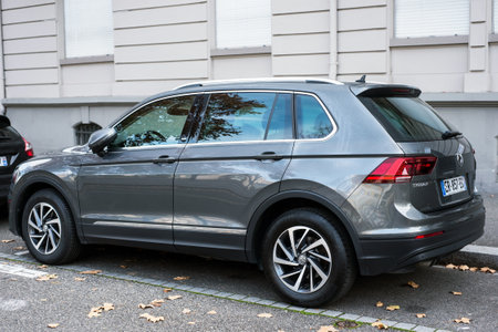 Mulhouse - France - 22 November 2020 - Profil view of grey Volkswagen Tiguan parked in the street