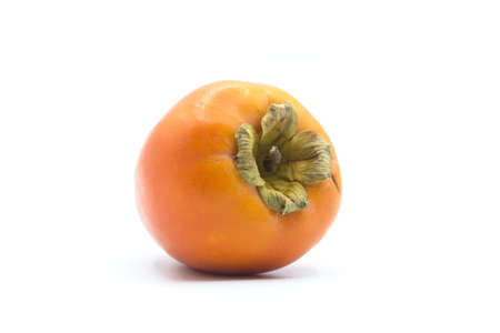 Closeup of organic Kaki on white background