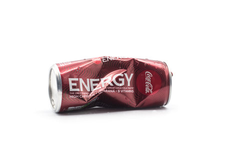 Mulhouse - France - 2 December 2020 - Closeup of crushed can of energy drink by  Coca-cola company  on white backgroundのeditorial素材