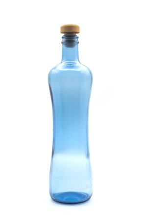 Closeup of blue glass bottle on white backgroundの写真素材