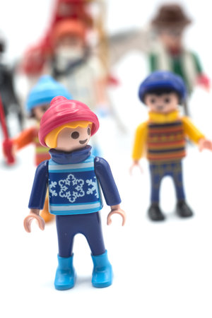 Mulhouse - France - 10 December 2020 - Closeup of figurines of playmobil kids standing on white backgroundのeditorial素材