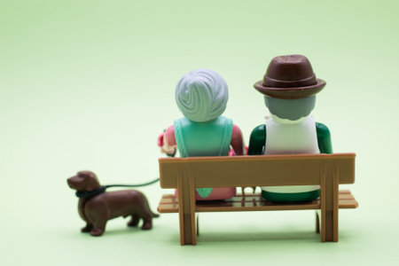 Mulhouse - France - 10 December 2020 - Closeup of playmobil figurines on green background - old...
