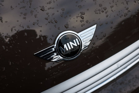 Mulhouse - France - 13 December 2020 - Closeup of rain drops of brown mini cooper front car parked in the streetのeditorial素材