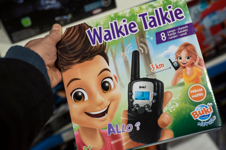 Mulhouse - France - 17 December 2020 - Closeup of talkie walkie toys in hand in a toys store shelfのeditorial素材