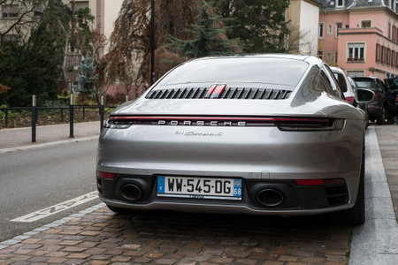 Mulhouse - France - 19 December 2020 - rear view of new Porsche 911 carrera S parked in the streetのeditorial素材