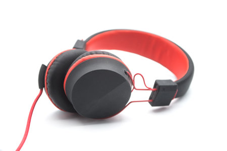 Closeup of black and red headphones on white backgroundの写真素材