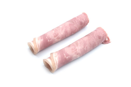 Closeup of rolled ham on white background