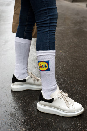 Strasbourg - France - 7 January 2021 - Closeup of sport socks by lidl on feet of girls standing in the streetのeditorial素材