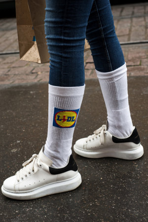 Strasbourg - France - 7 January 2021 - Closeup of sport socks by lidl on feet of girls standing in the streetのeditorial素材