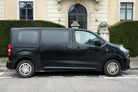 Mulhouse - France - 9 January 2021 - Profile view of black Peugeot traveller van parked in the...