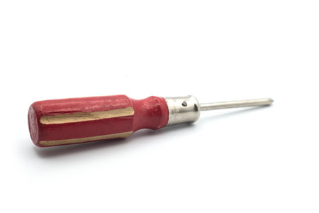 Closeup of red wooden screwdriver on white backgroundの写真素材