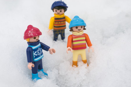 Mulhouse - France - 18 January 2021 - Closeup of Playmobil kids figurines playing in the snow