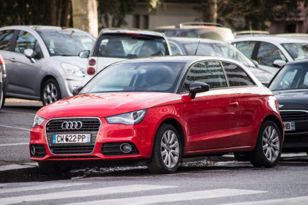 Mulhouse - France - 18 January 2021 - Front view of red Audi A1 parked in the street, Audi is the famous german brand of cars