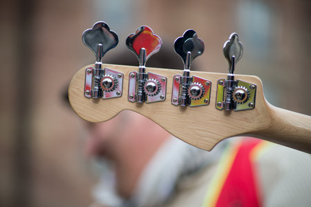 loseup of guitar bass instrument playing in the street