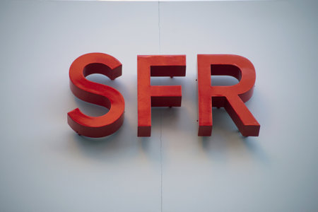 Mulhouse - France - 21 February 2021 - Closeup of SFR logo on phone store front, SFR is the famous french phone operatorのeditorial素材